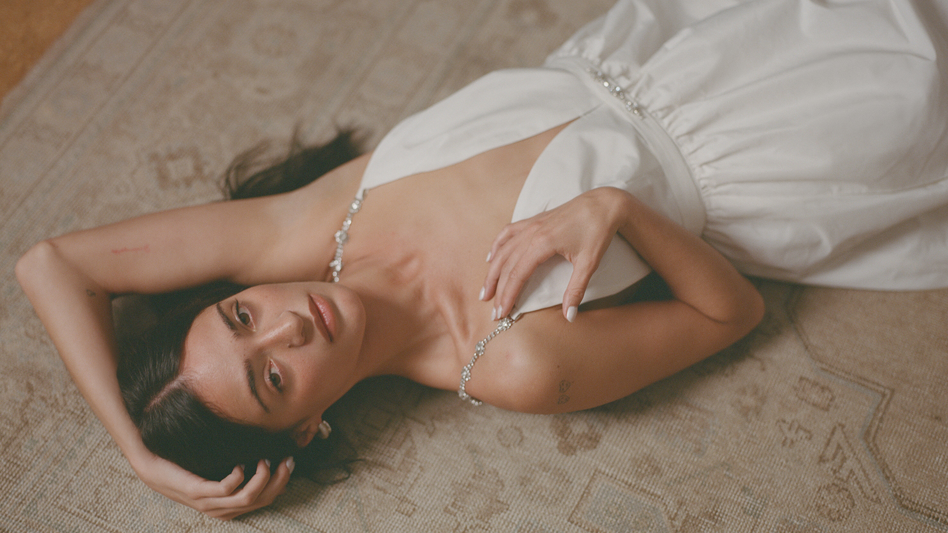 Model wearing white outfit from Maje White Edit collection